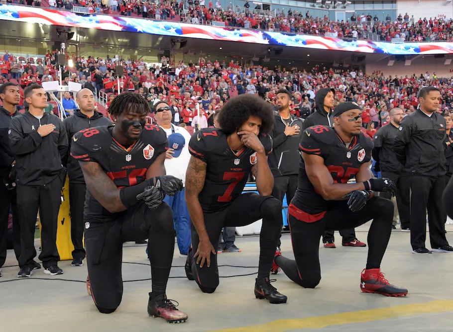 Colin Kaepernick kneeling during the national anthem