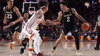 Colorado Buffaloes guard K.J. Simpson makes a move with the basketball against the USC Trojans