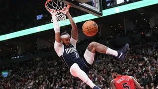 Kings vs Nuggets Predictions - Dallas Mavericks' Daniel Gafford hangs from the hoop
